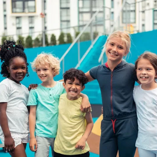 kids posing on track