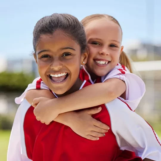 two kids hugging